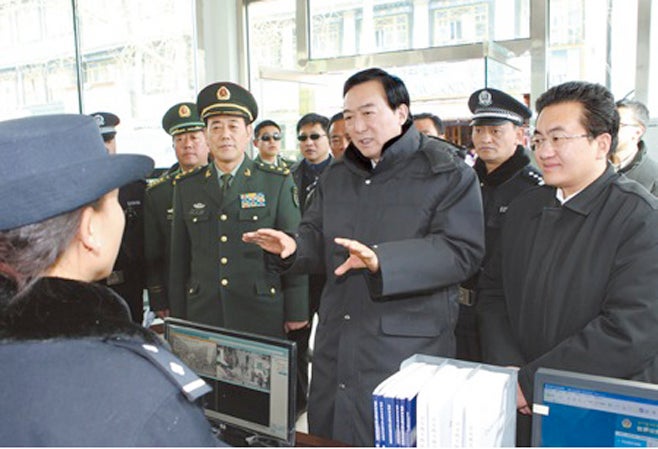 Chen Quanguo visits a "convenience police-post" in Lhasa, TAR, during Chinese New Year festivities in 2012.