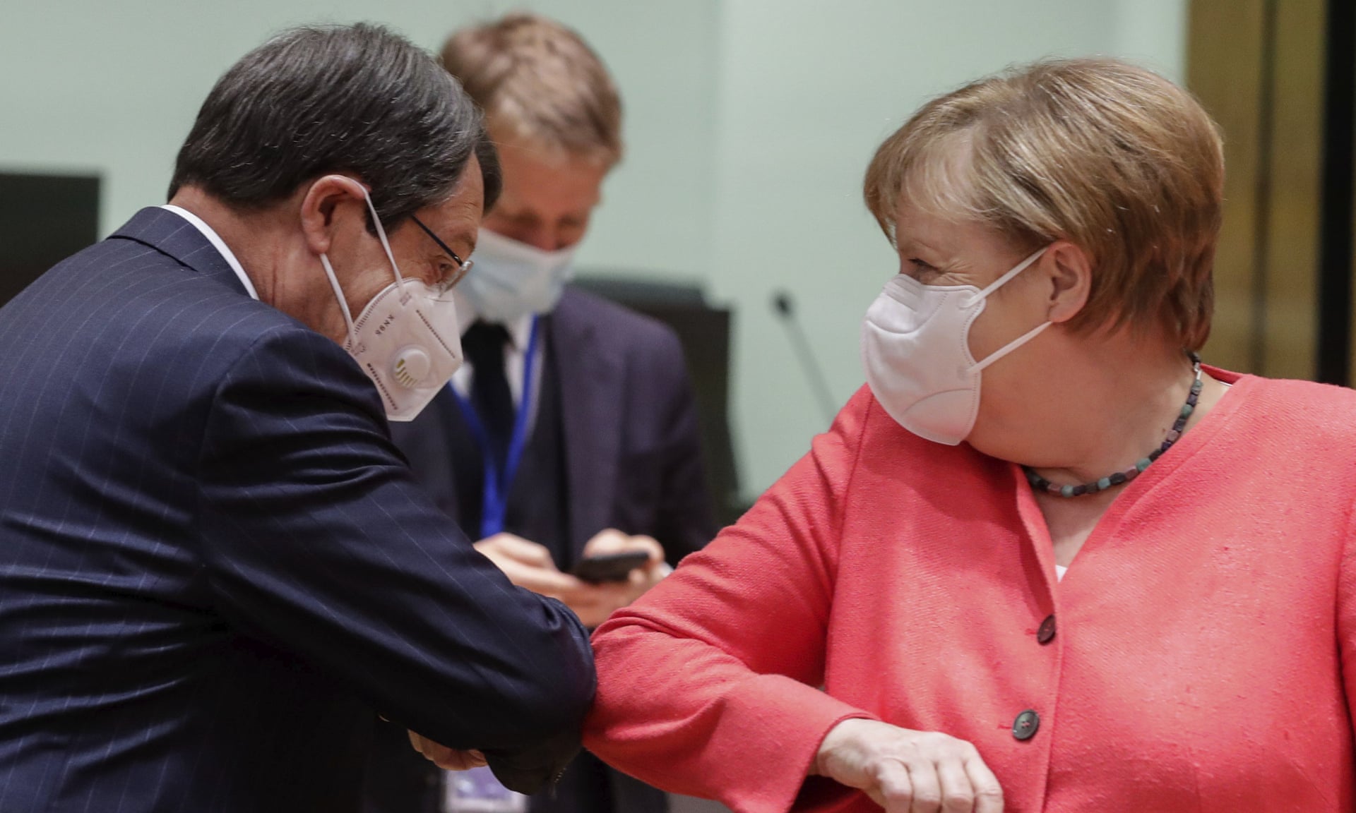 German Chancellor Angela Merkel greets Cypriot president Nicos Anastasiades at the EU summit in Brussels, July 21, 2020.