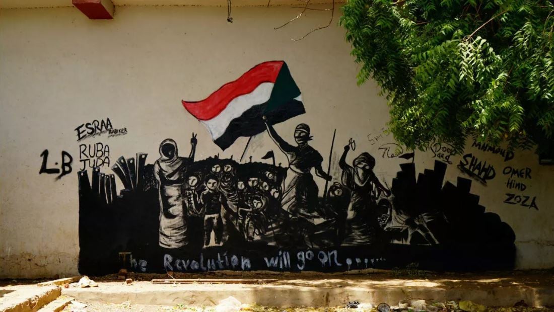 A mural reading, "The Revolution will go on" is seen on a wall in Khartoum, Sudan, June 18, 2019.