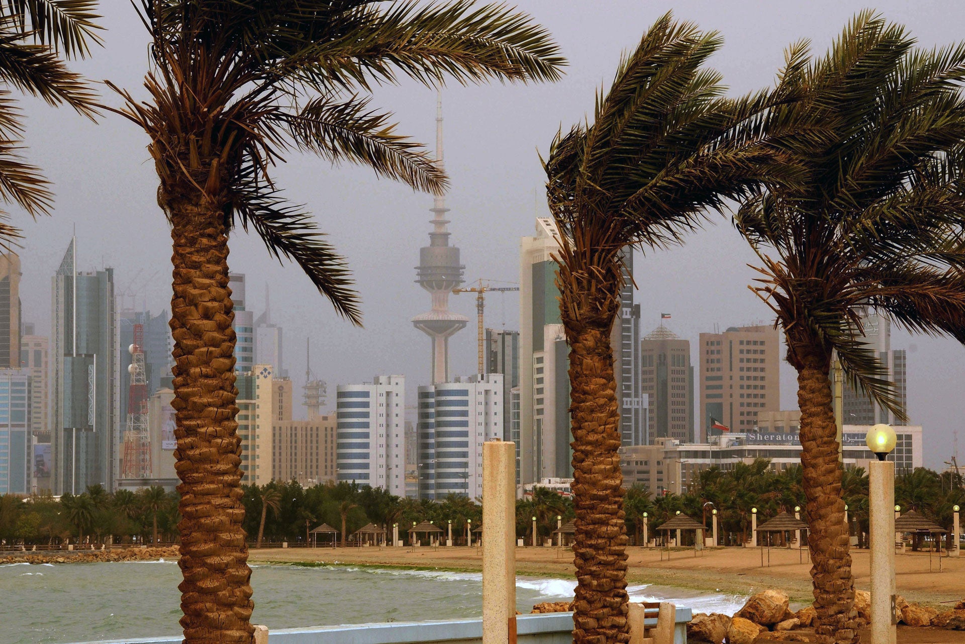 The Kuwait city skyline is seen through the haze of a sand storm in Shuwaikh, Kuwait City.