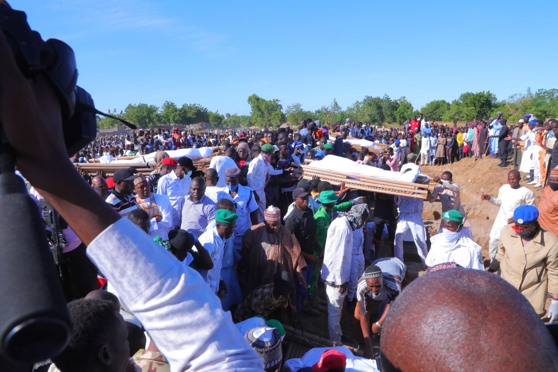 People attend a funeral for people killed by suspected Boko Haram in Zaabarmar, Borno, Nigeria, November 29, 2020. 