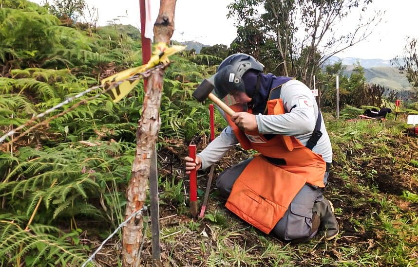 A deminer works in Algeciras, Huila Department, Colombia in July 2020.  