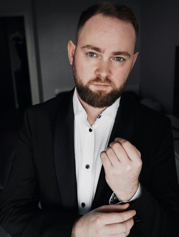 Ilya Bronsky wearing a jacket and shirt