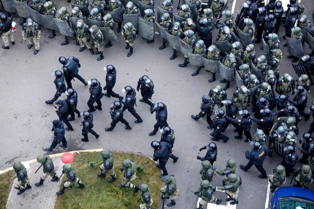 Belarusian riot police block the road to stop demonstrators during an opposition rally to protest the official presidential election results in Minsk, Belarus on November 15, 2020.
