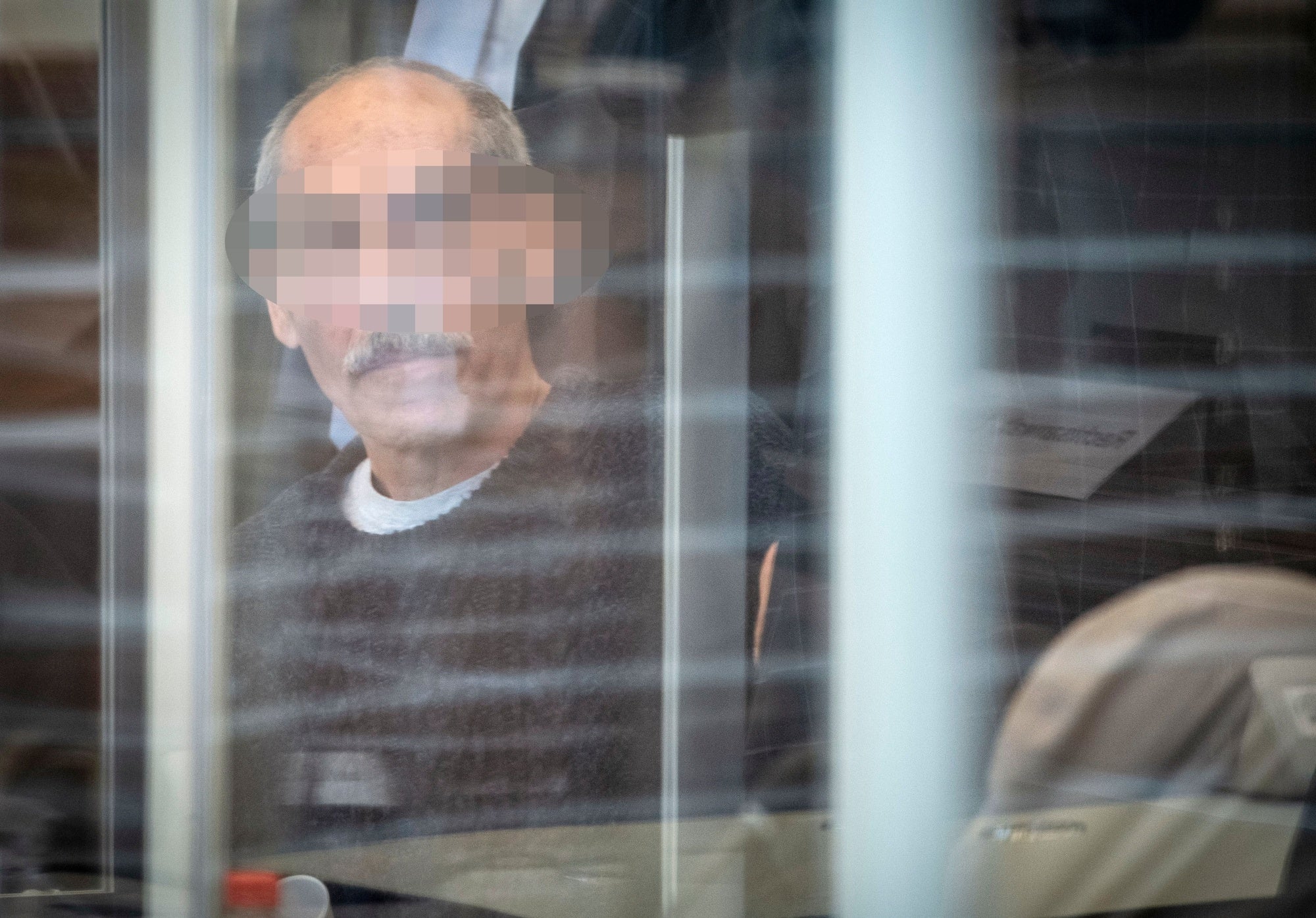 Defendant Anwar R. arrives at court in Koblenz on April 23, 2020 for an unprecedented trial on state-sponsored torture in Syria. 