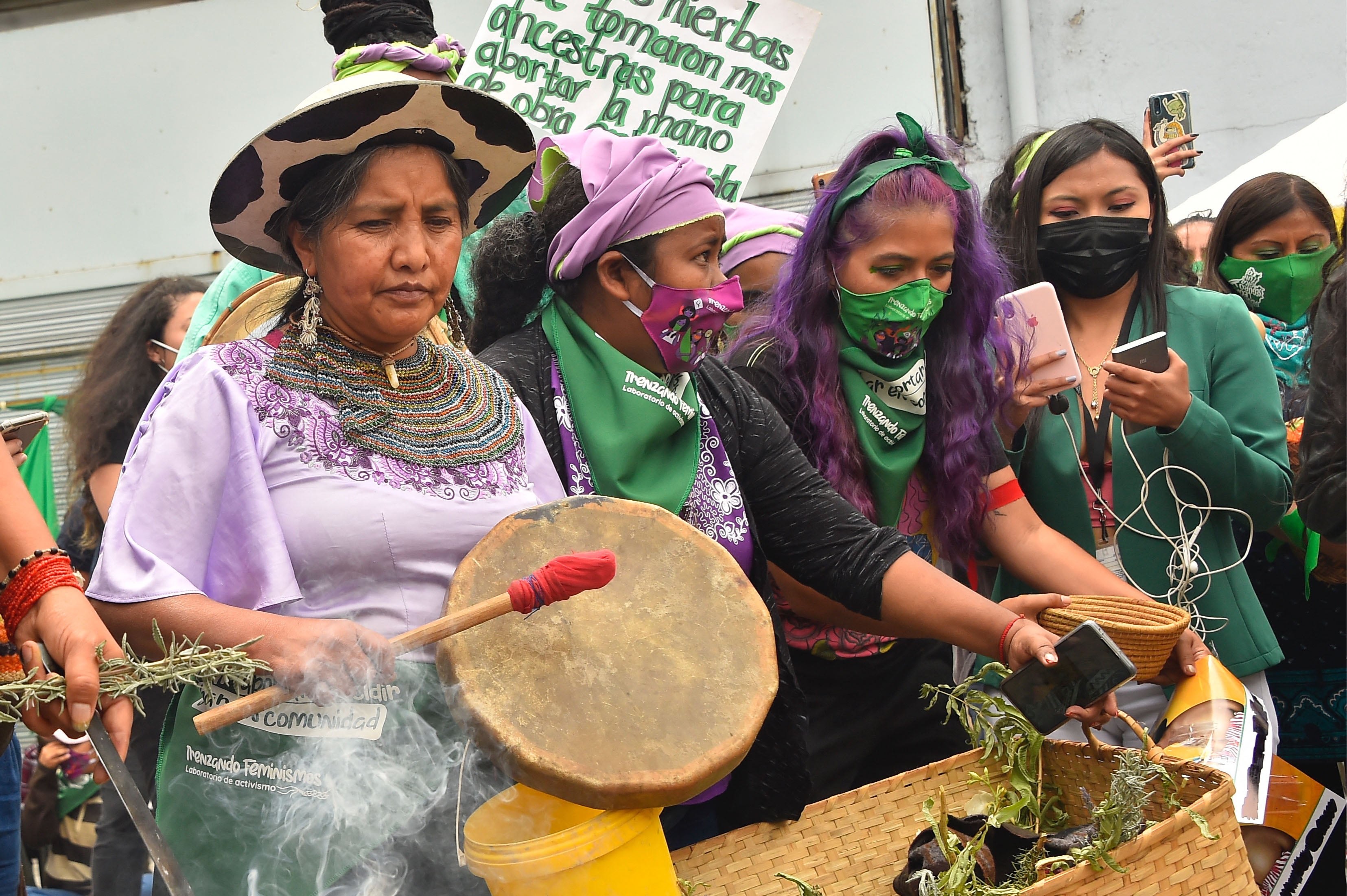 A group of women protesters playing drums