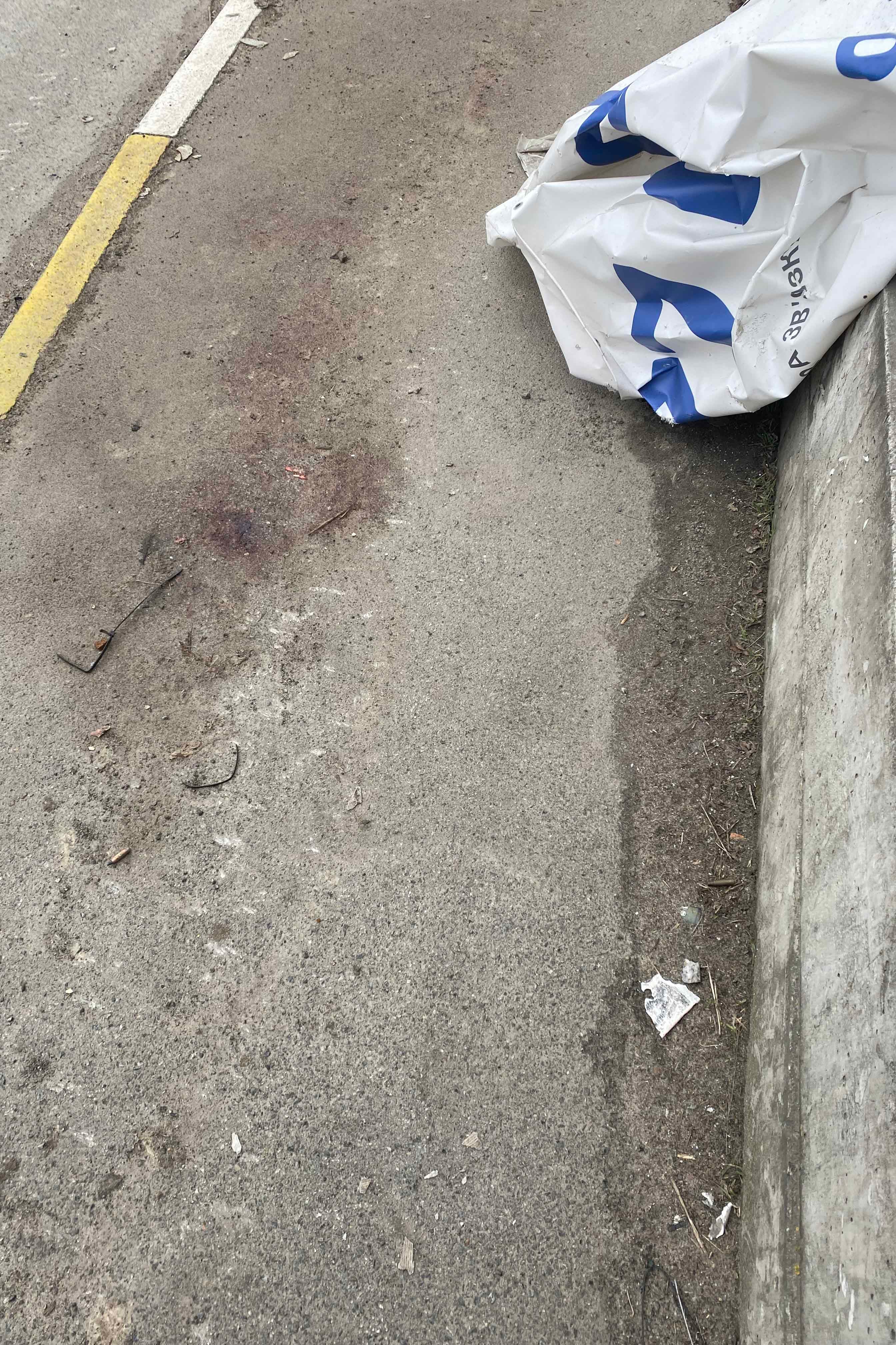 A large bloodstain on the corner of Yablunska and Vokzlana streets in Bucha