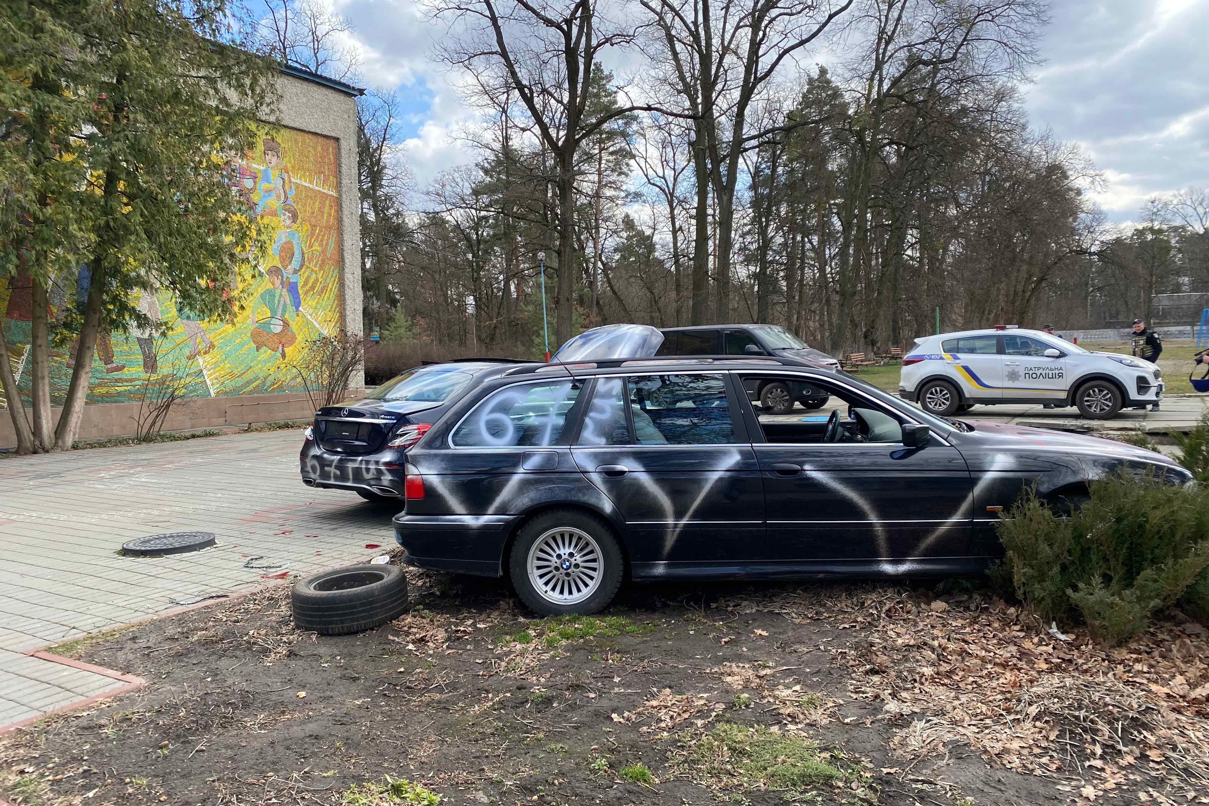 Private vehicles with “V”s spray-painted on their exteriors
