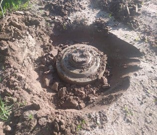 A TM-62M anti-vehicle mine equipped with MVCh-62 pressure activated fuze cleared near Kyivka in Chernihiv region, Ukraine, after a tractor driver was killed by another TM-62 mine in the same field on May 23, 2022. 
