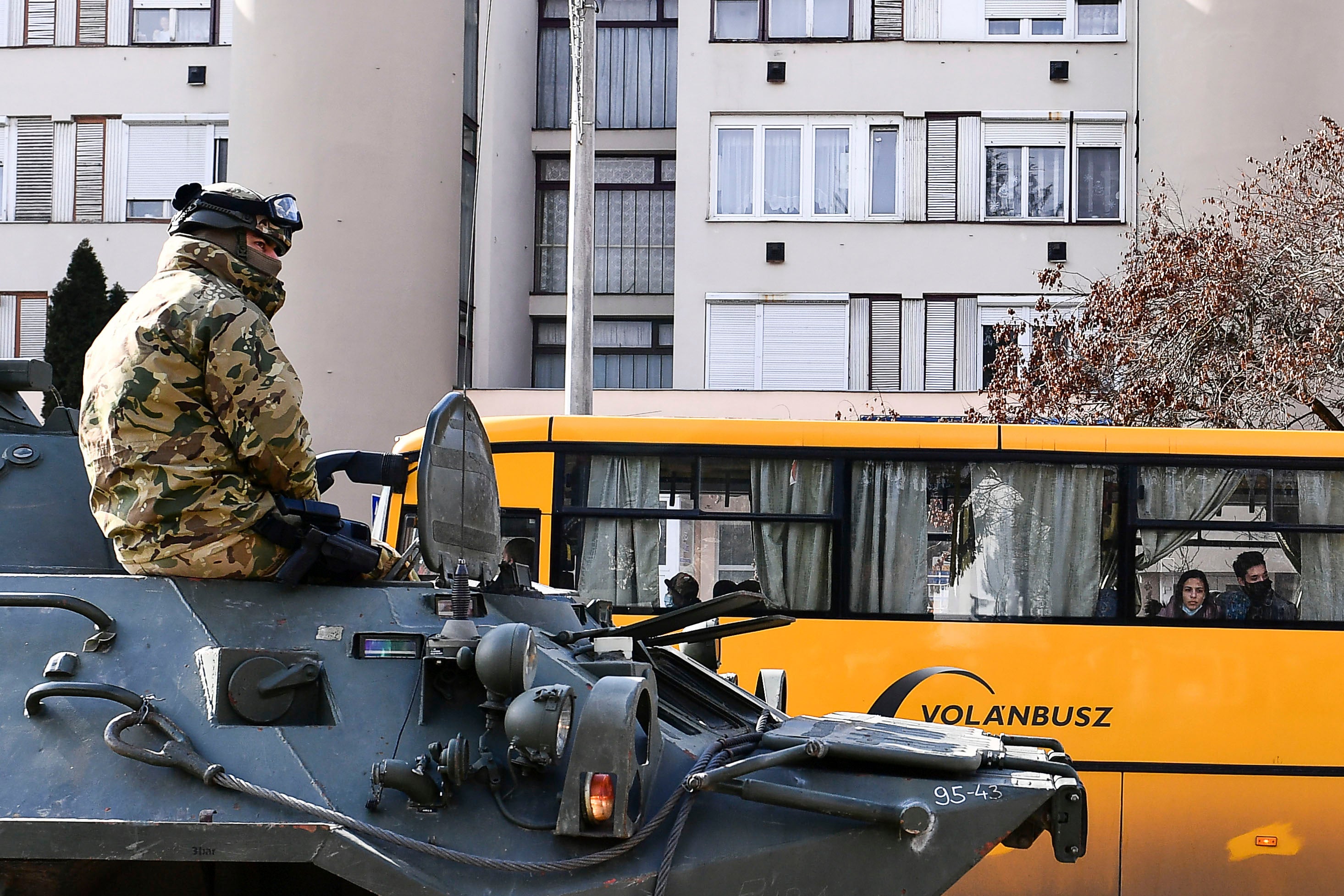 A troop rides in an armored personnel carrier