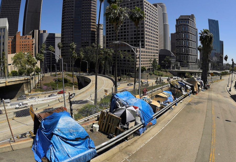 An encampment on Beaudry Avenue along Interstate 110 in downtown Los Angeles.