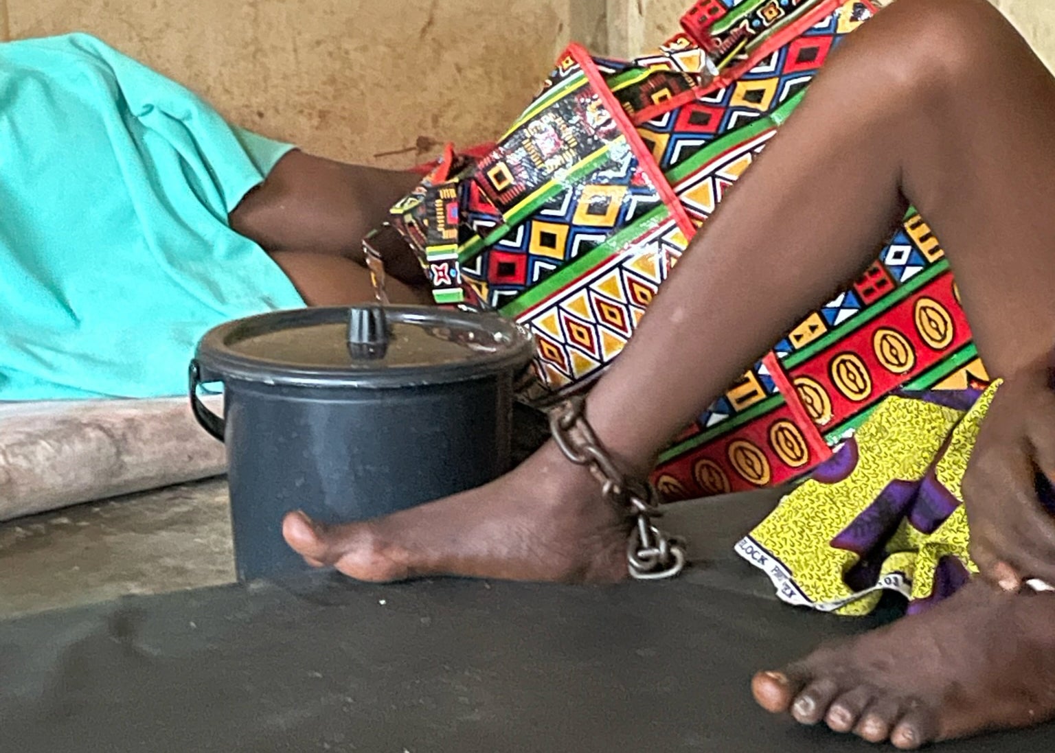 A woman with a real or perceived psychosocial disability is chained in a room at Mount Horeb Prayer Camp in Ghana.