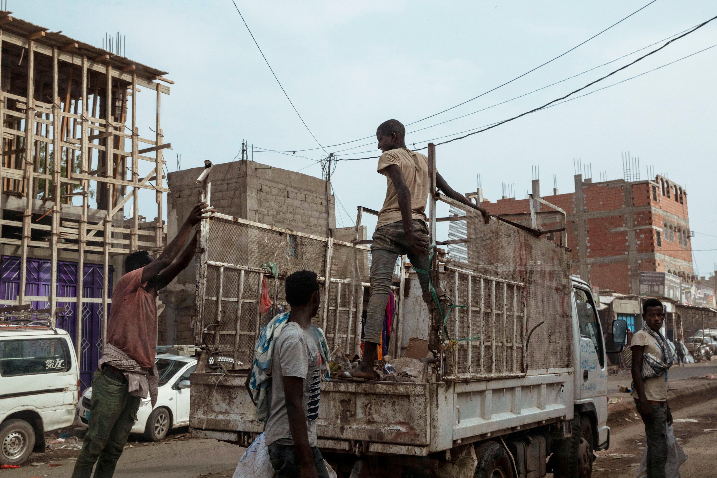 Ethiopian migrants climb on a pickup truck in Dhale province in Yemen.