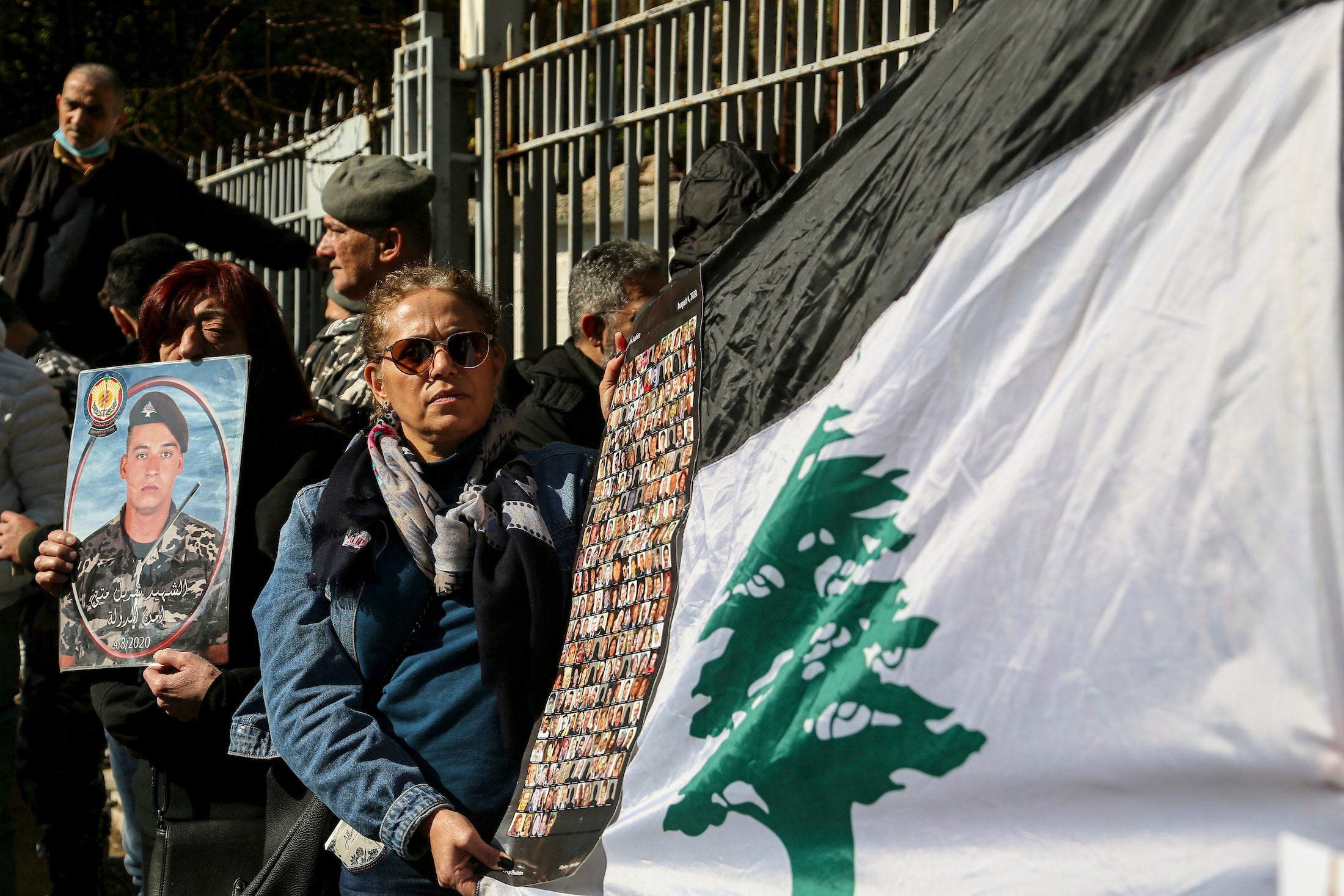 Lebanese activists and families of the victims of the 2020 Beirut port blast gather outside the Palace of Justice to protest a decision by Lebanon's top prosecutor to release the suspects detained in connection with the explosion. 