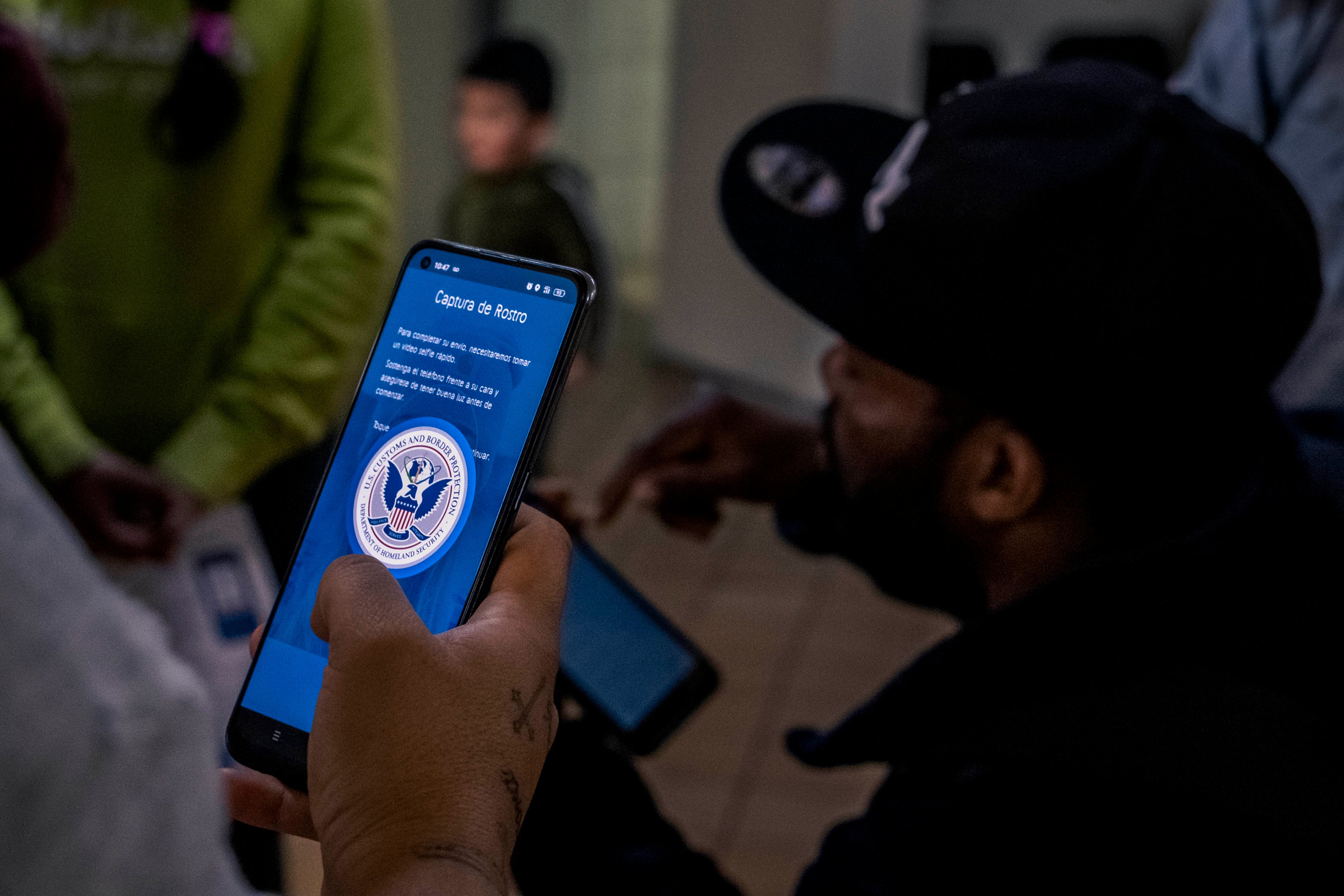 A person uses an app on their cell phone