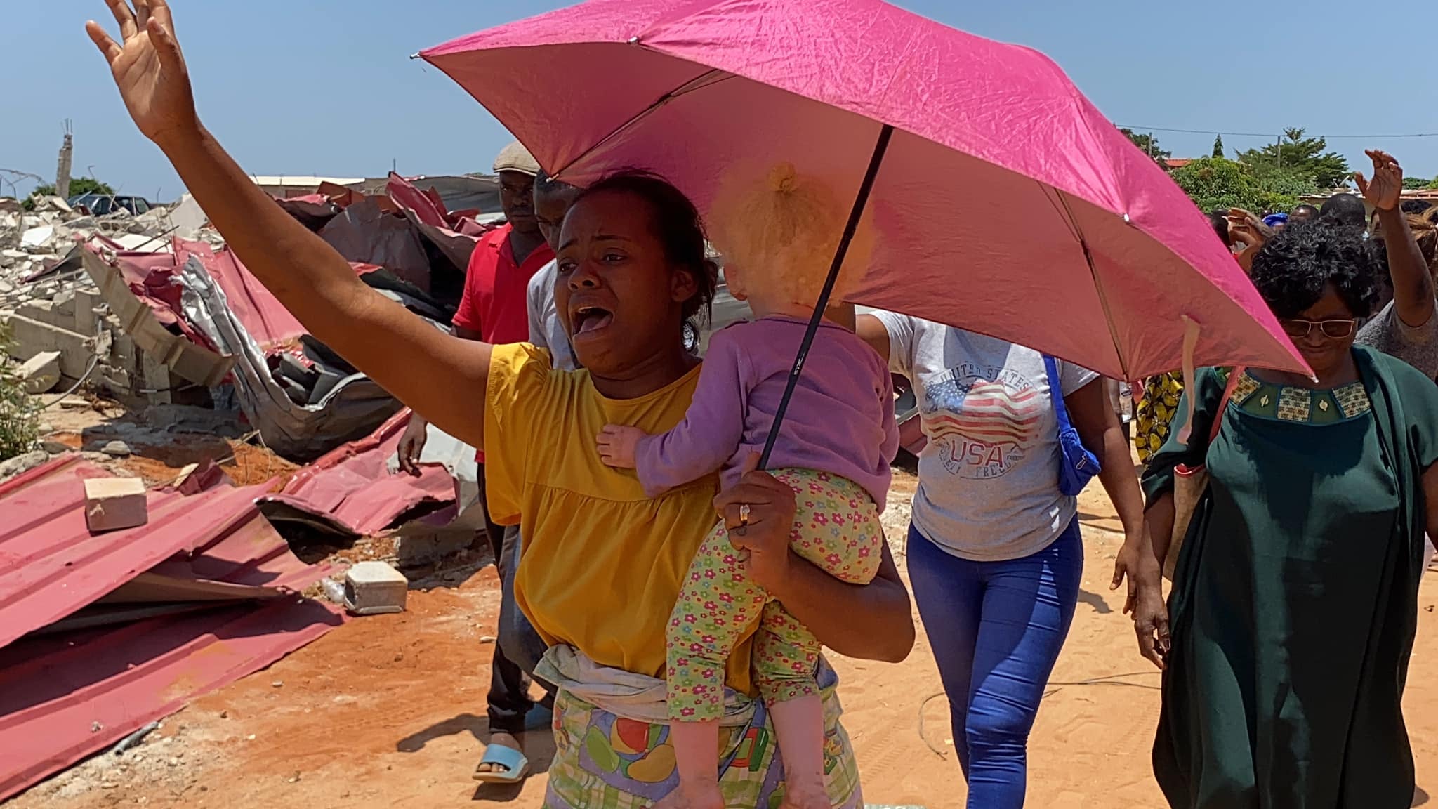 angola woman baby crying woman outside