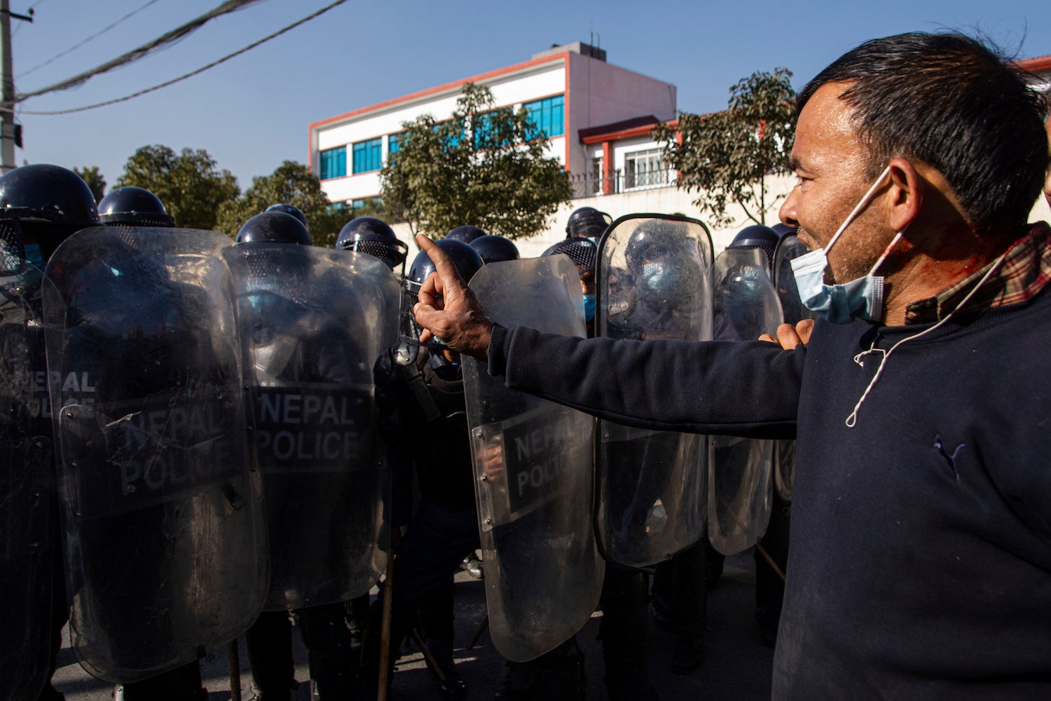 Nepalese youth clash with police as they protest outside Federal Parliament in Kathmandu, Nepal.