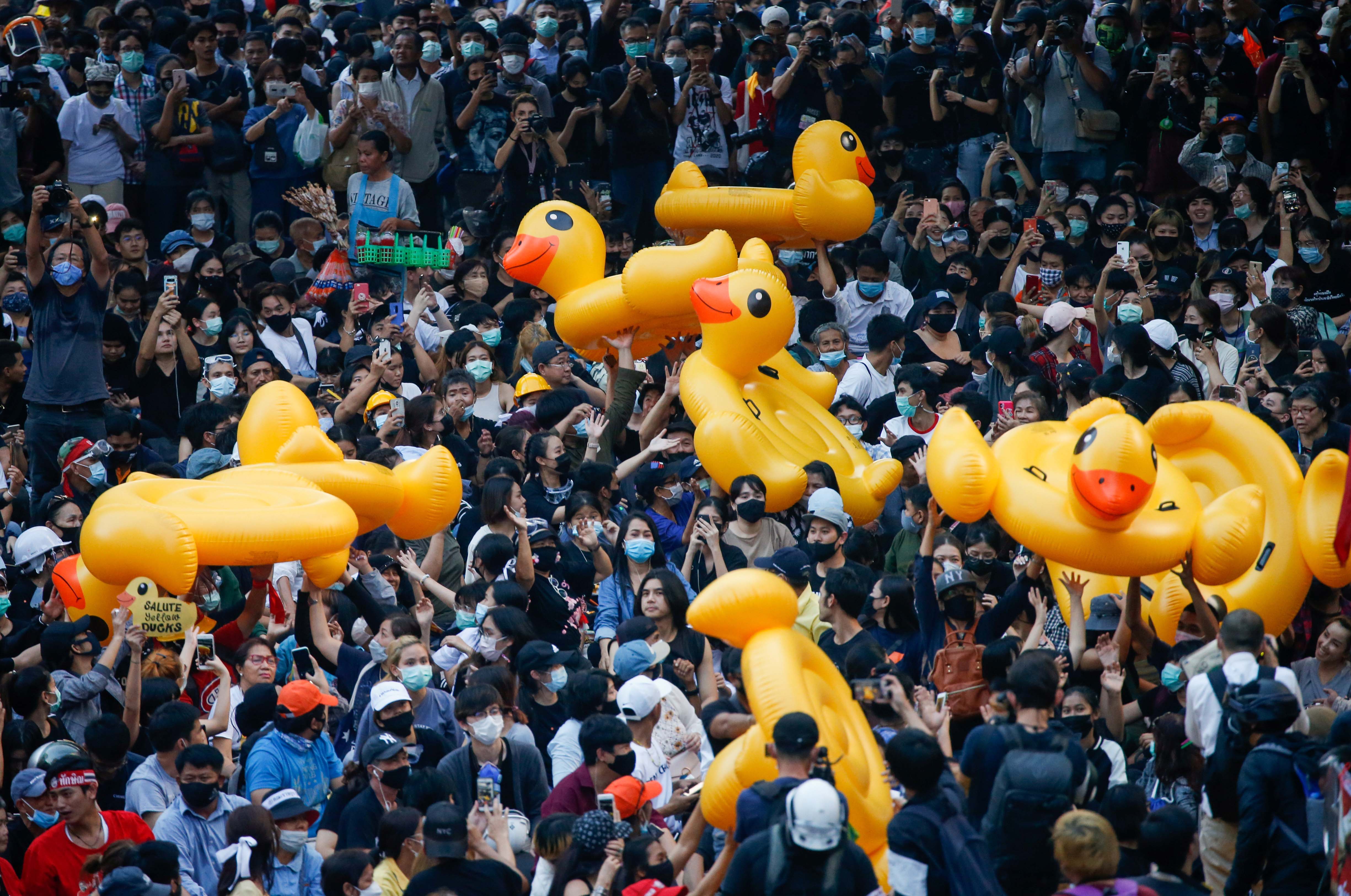 Pro-democracy demonstrators move inflatable rubber ducks during a rally in Bangkok, Thailand.
