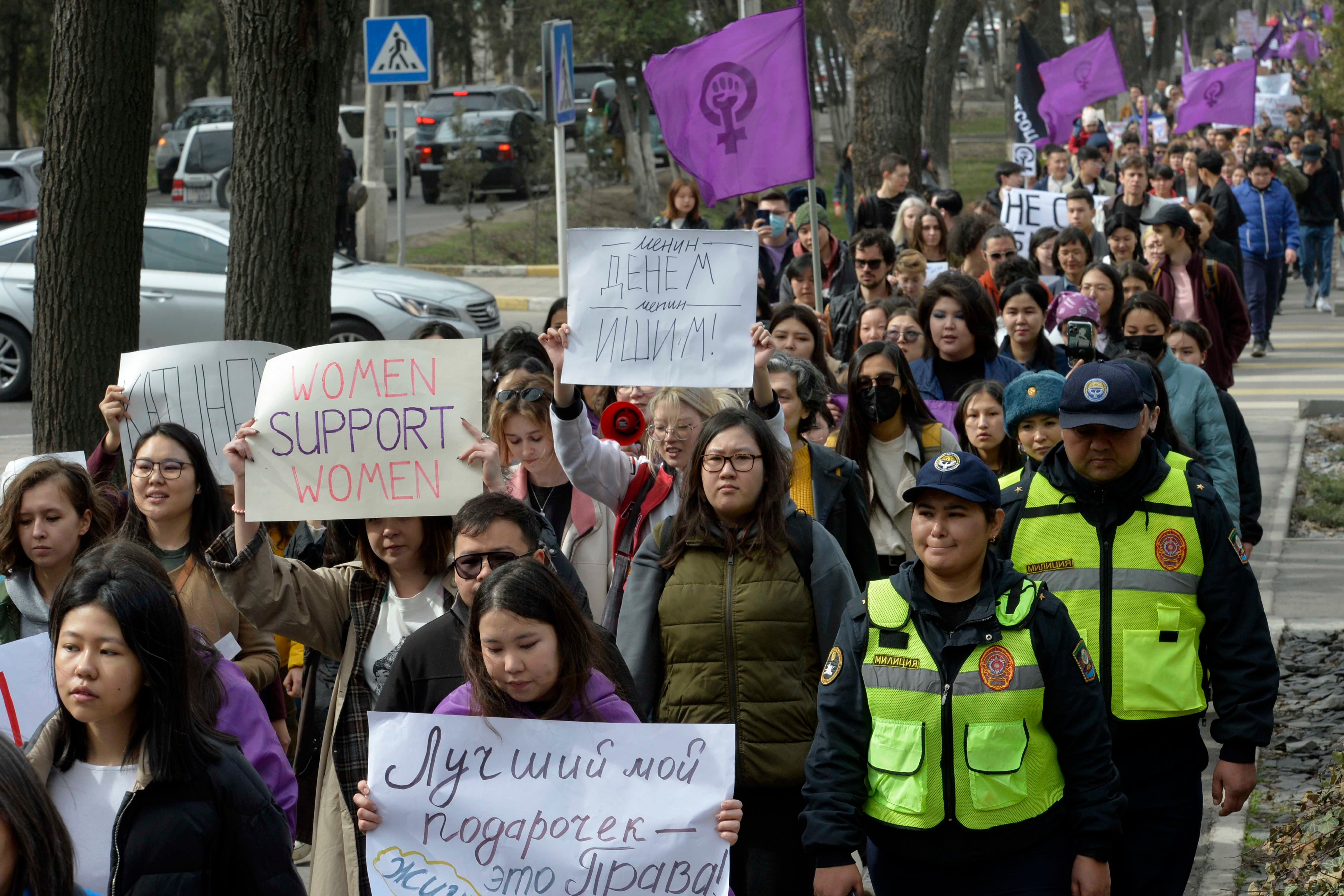 Women march in a protest for International Women's Day