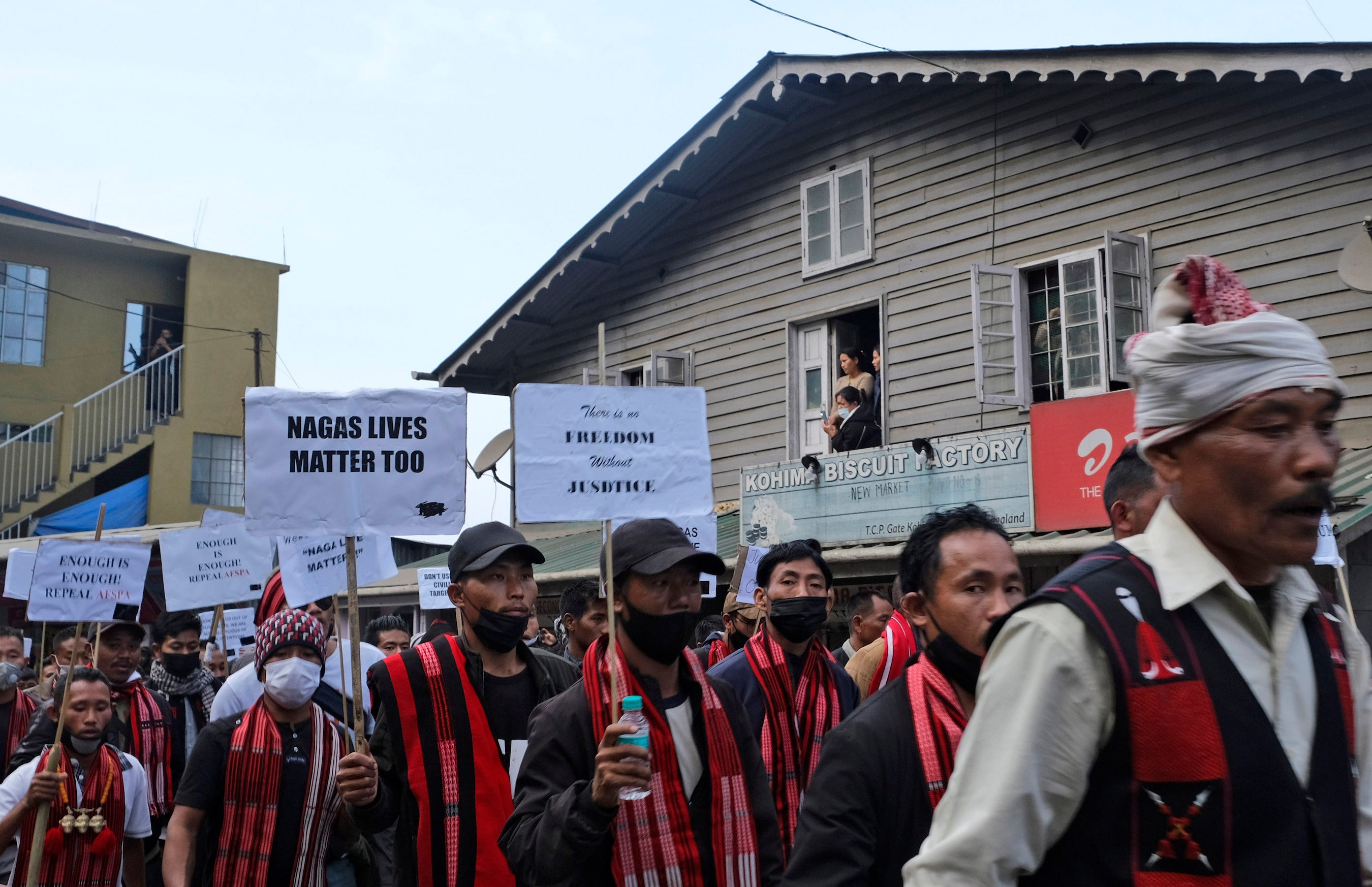 Ethnic Nagas hold placards and participate in a 70-kilometer walk demanding the repeal of the Armed Forces Special Powers Act (AFSPA) in Kohima, Nagaland, India in 2022.