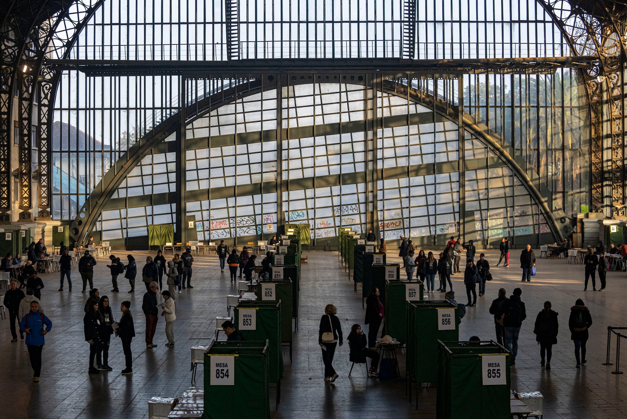 People vote at the former Mapocho train station, now a cultural center, during an election to choose members of a council to draft a proposed new constitution, Santiago, Chile, May 7, 2023. 