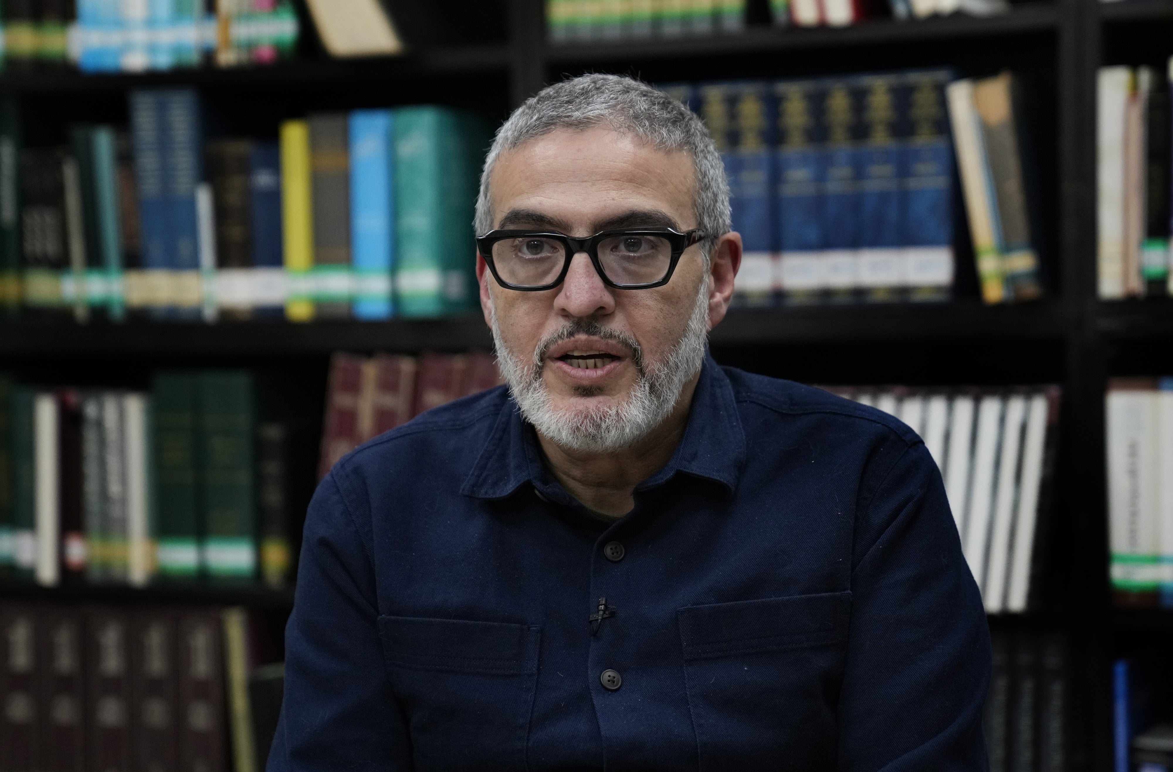 Dr. Ghassan Abu Sittah, a Palestinian-British plastic surgeon specializing in conflict medicine, speaks during an interview at the Institute for Palestine Studies in Beirut, Lebanon, December 9, 2023. © 2023 AP Photo/Hussein Malla