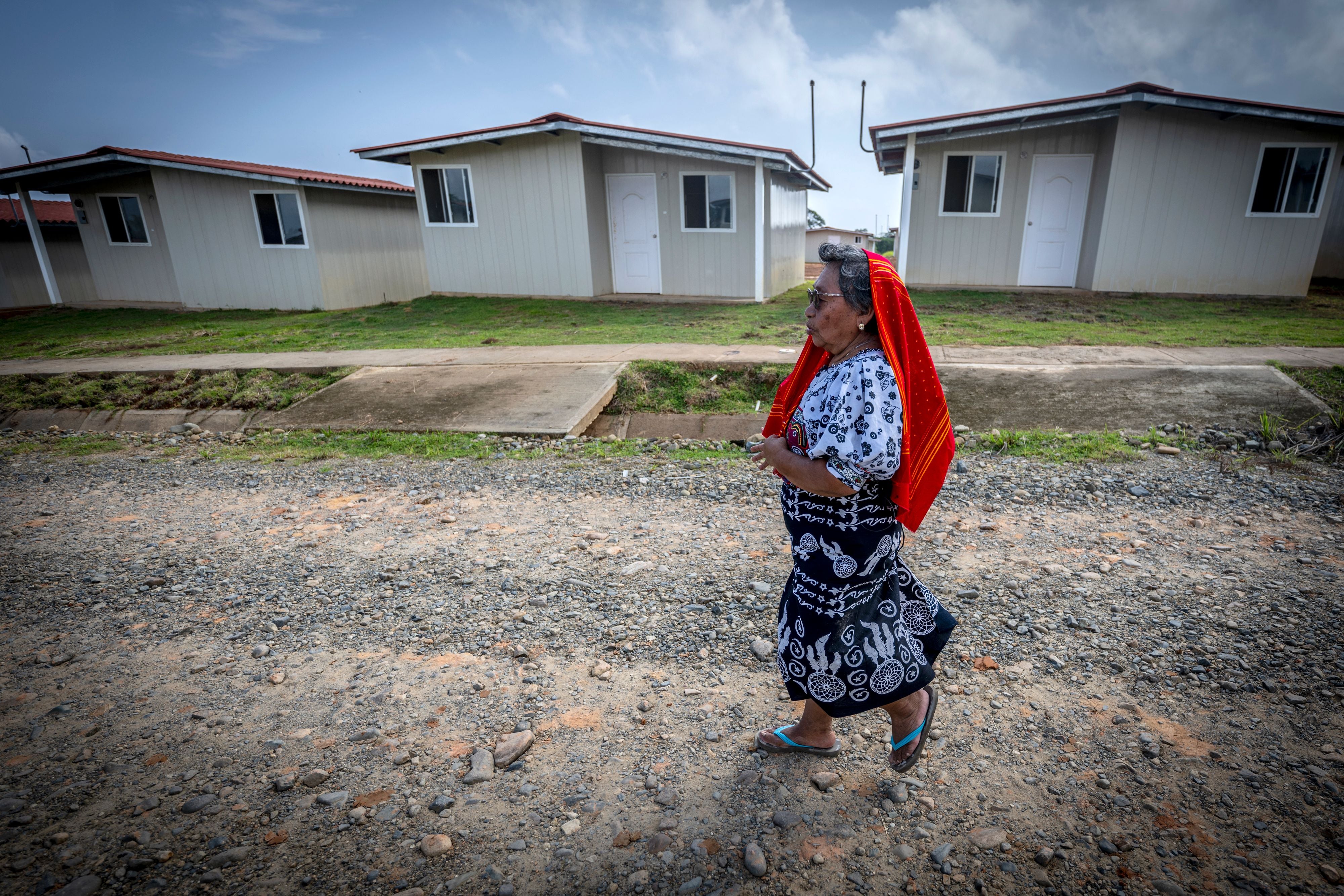 A Guna Indigenous woman walks in Isber Yala, the site where her new, safer house was built in Guna Yala Comarca, Panama, August 30, 2023. 