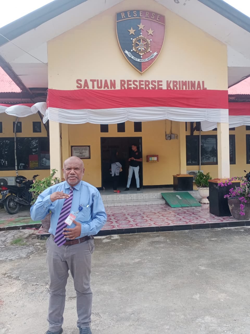 Yan Christian Warinussy outside the Manokwari criminal investigation unit, West Papua, Indonesia.