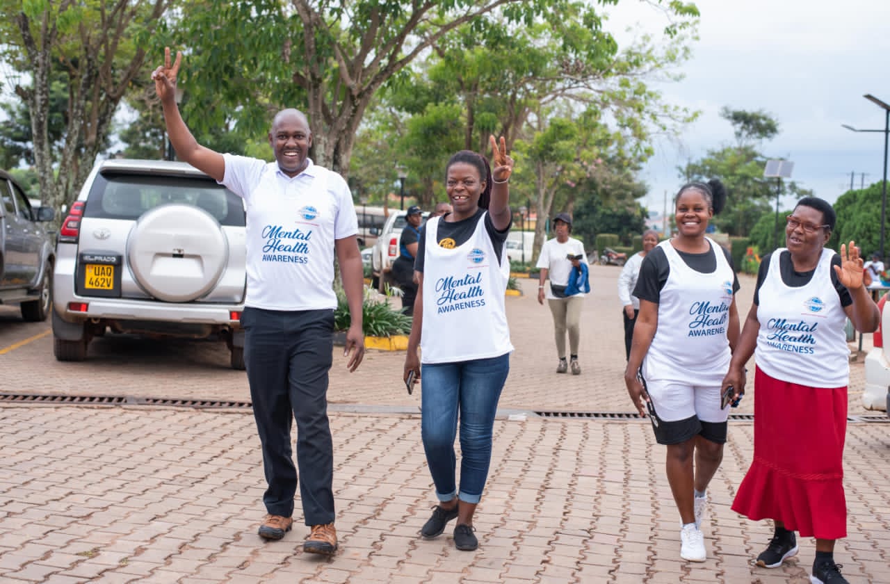 Benon Kabale, left, participates during an event on mental health awareness during the Lubowa Community and Toastmasters Mental Health Run/Walk on November 2, 2024, in Lubowa, Kampala.