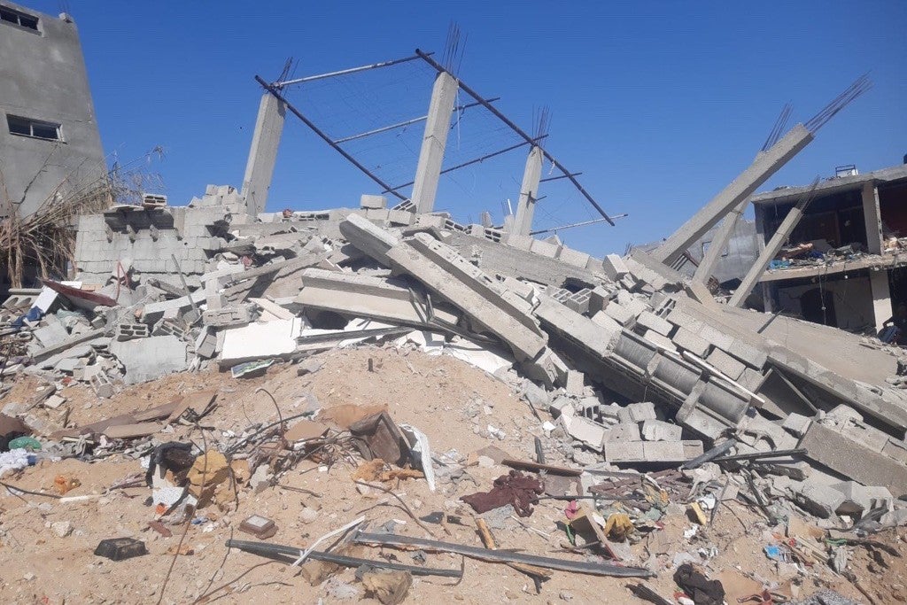 Photo showing a house reduced to rubble