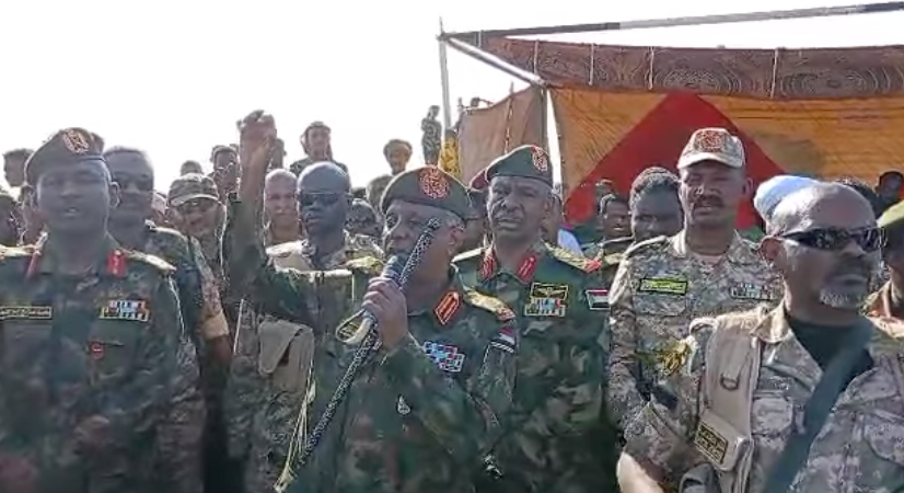 Sudanese Armed Forces General Yasir al-Atta addresses a public meeting with Keikel (second from the right) on January 19, nine days after the Sudan Shield attack on Tayba, saying “[b]ecause now, the Sudanese army, the Sudanese police, the Sudanese intelligence and security, the Joint Forces, the Sudan Shield, and the Sudanese Popular Resistance are all the Sudanese people; they are the Sudanese army”.