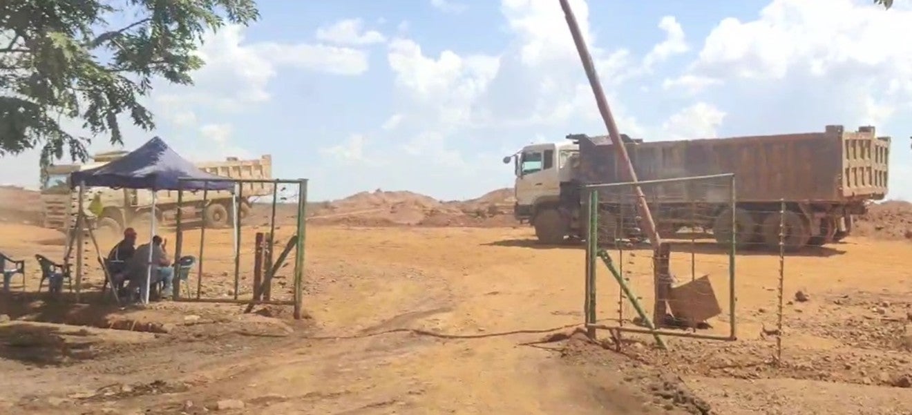 Trucks removing lead waste