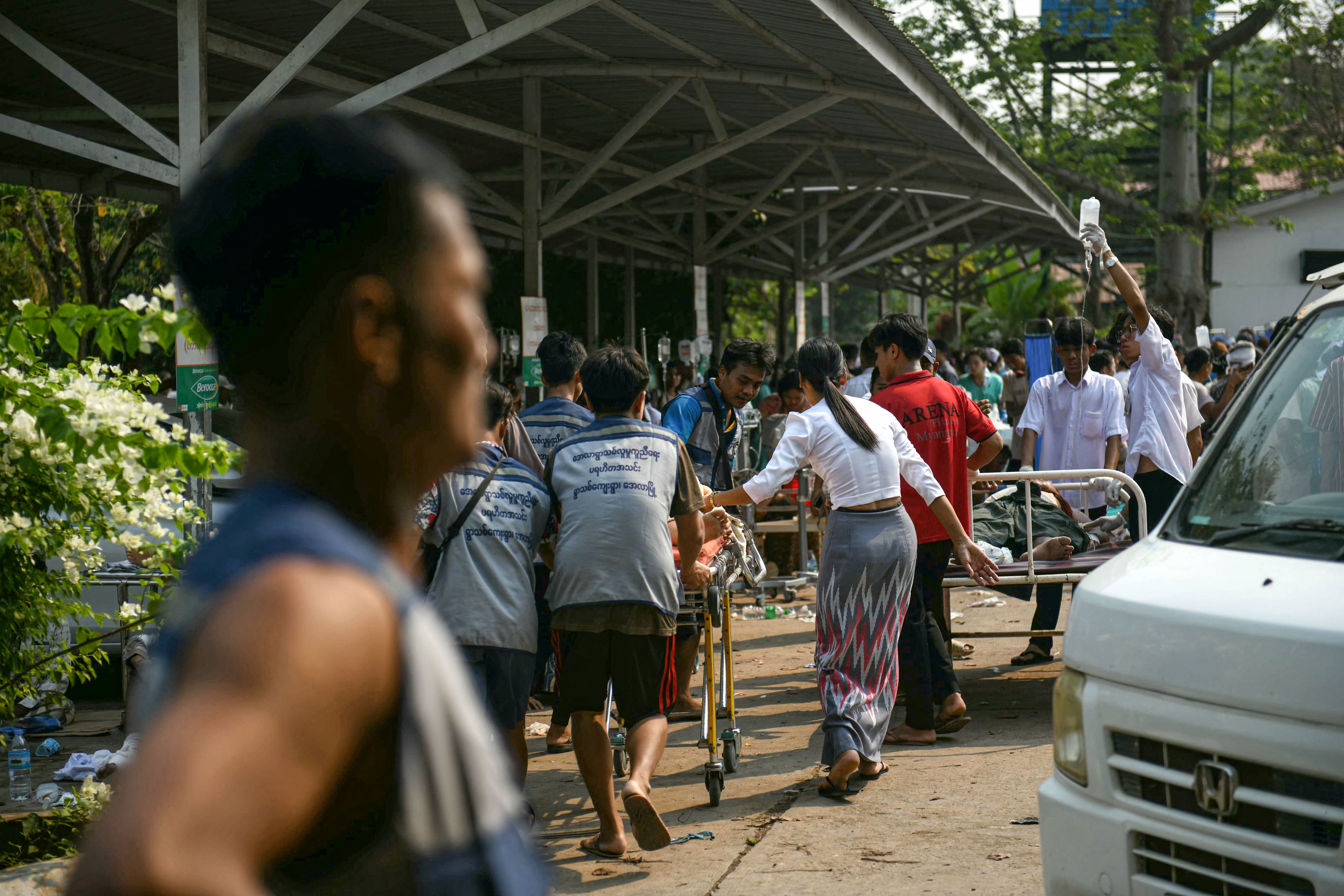 Medical workers transport an earthquake casualty at a hospital