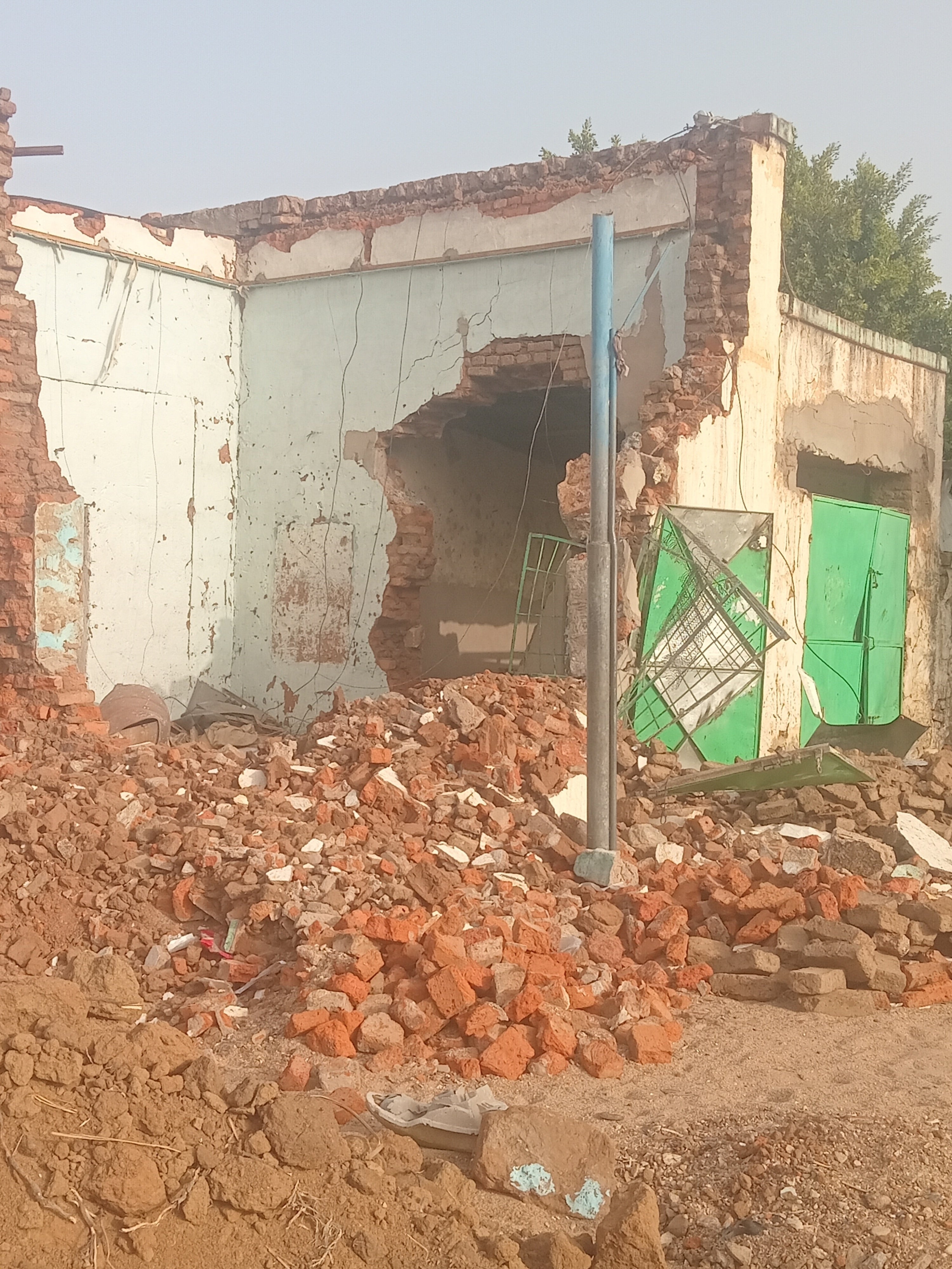 A photograph by a Nyala resident taken on April 4, 2025, shows a damaged house at the location of a February 3 airstrike on Congo Road in Nyala, South Darfur. 