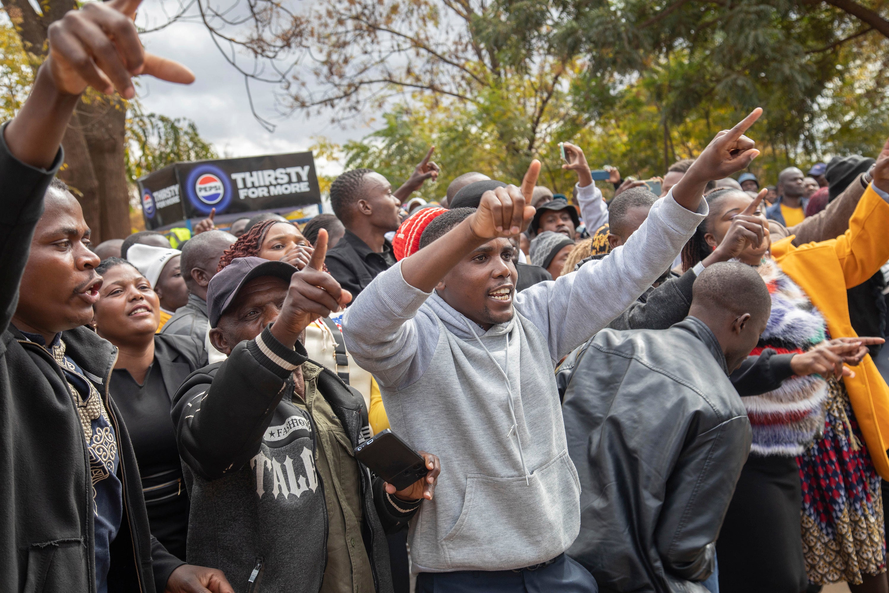 Opposition supporters protest outside a court in Harare, Zimbabwe, June 27, 2024.