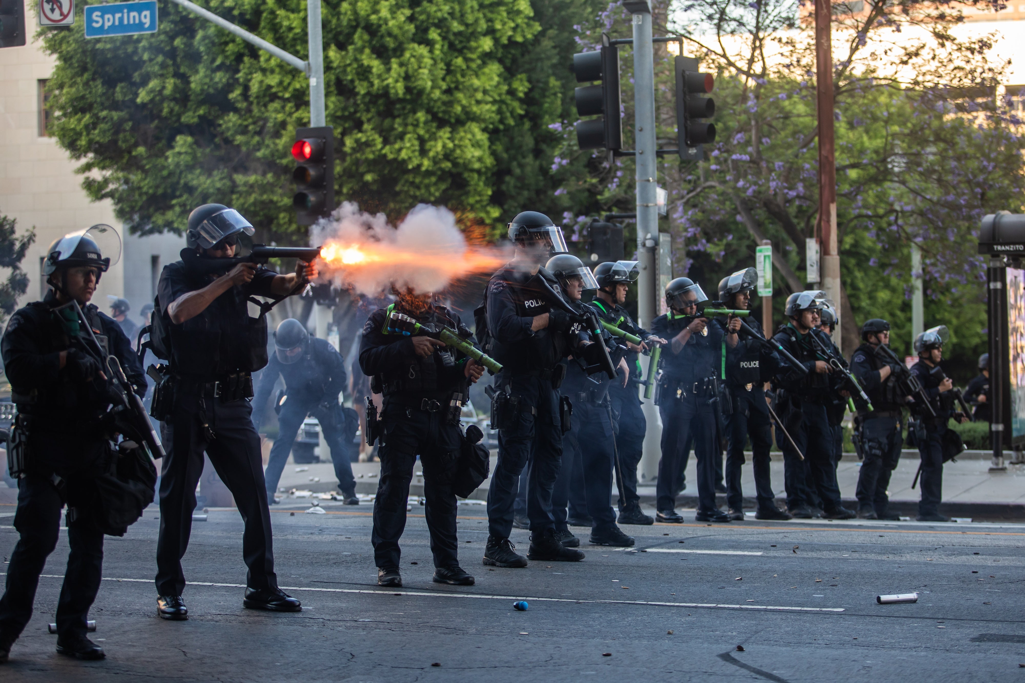 Los Angeles Police Department officers shoot kinetic impact projectiles at protesters outside City Hall  in Los Angeles, California, on June 8, 2025. © 2025 Apu Gomes/Getty Images