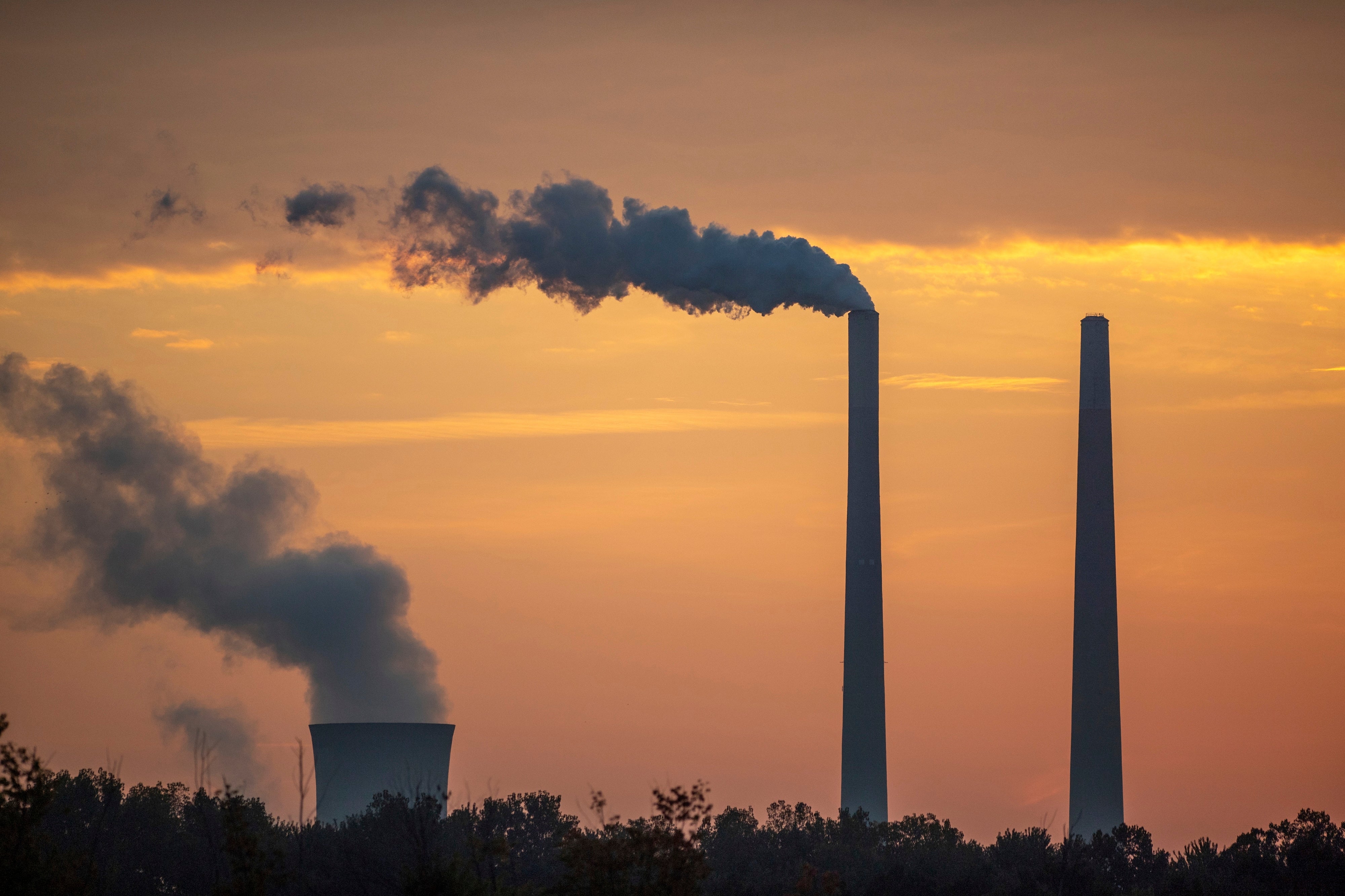 Pollution and steam rise from the stacks of the Miami Fort Power Station, along the Ohio River, in Lawrenceburg, Indiana, US, September 21, 2025.