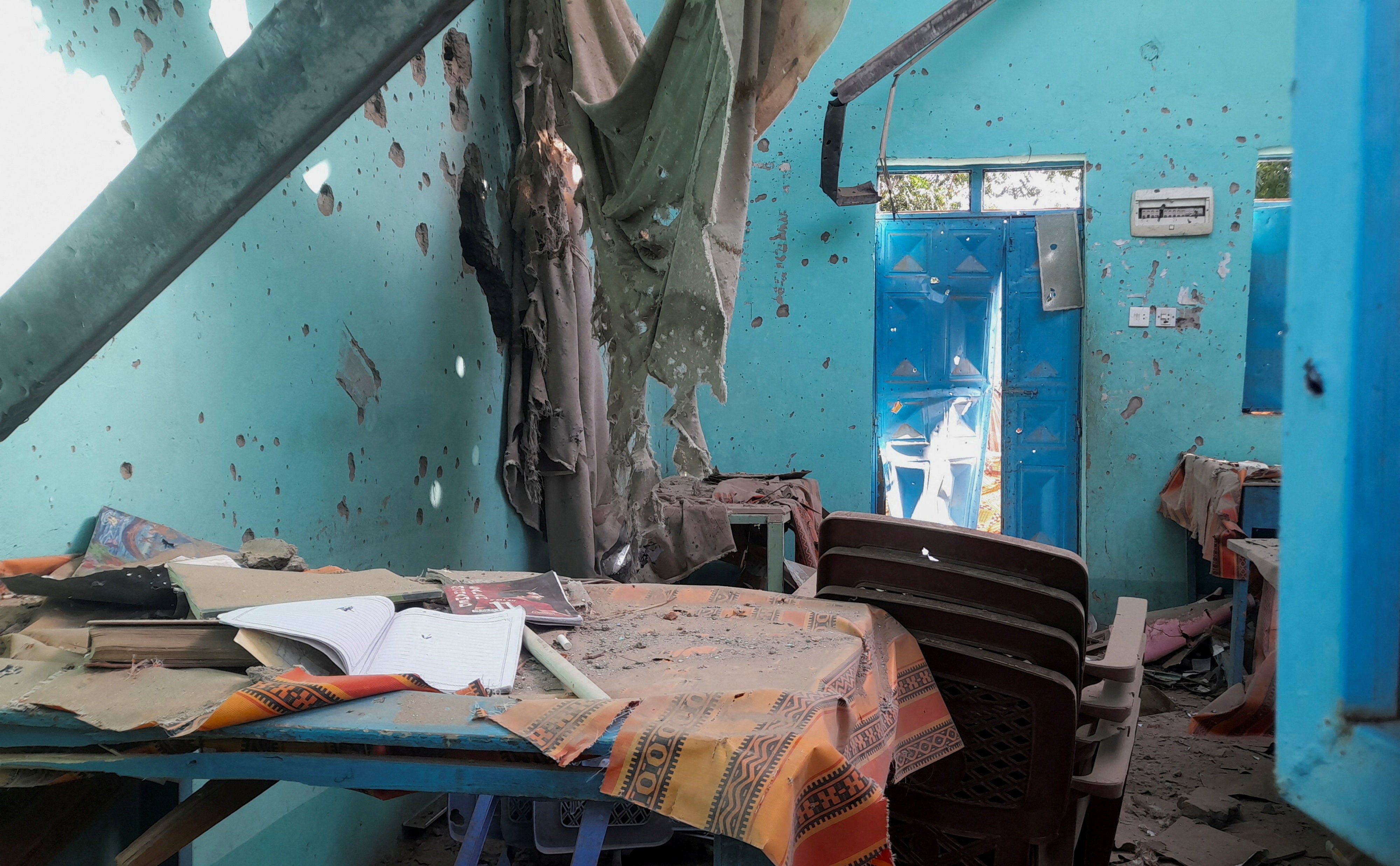 A desk bearing signs of shelling in a school where displaced people were sheltering, in El Fasher, Sudan, October 7, 2025. 
