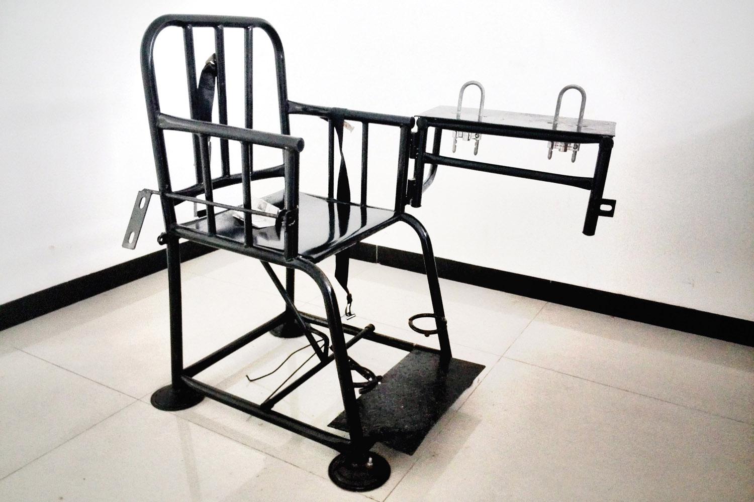 A “tiger chair” specially designed to restrain detainees. Former detainees say that police often strap them into these metal chairs for hours and even days, depriving detainees of sleep, and immobilizing them until their legs and buttocks were swollen.