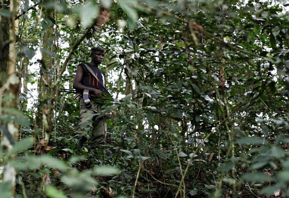 An FDLR fighter standing guard in a remote forest region of eastern Congo in February 2009. 
