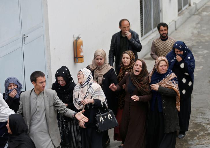 Relatives of victims mourn at a hospital after a suicide attack in Kabul, Afghanistan, on November 21, 2016. 