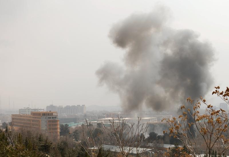 Smoke rises from a military hospital area at the site of blast and gunfire in Kabul, Afghanistan March 8, 2017.