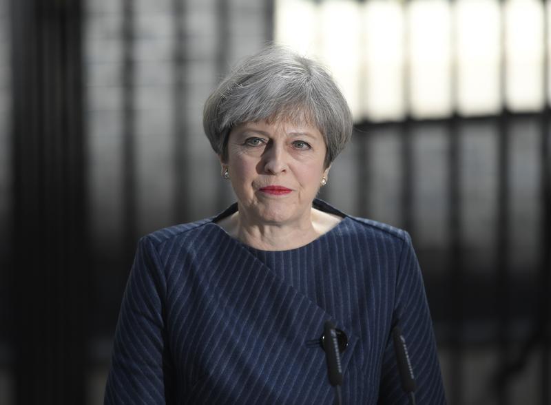 Britain's Prime Minister Theresa May speaks to the media outside 10 Downing Street, in central London, Britain April 18, 2017. 