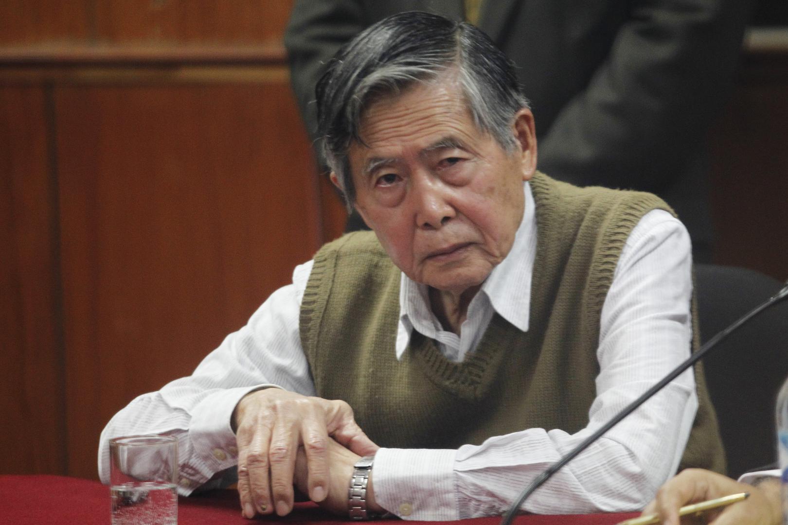 Peru's former President Alberto Fujimori listens to the judge's verdict about his sentence in prison, in Lima October 29, 2013.