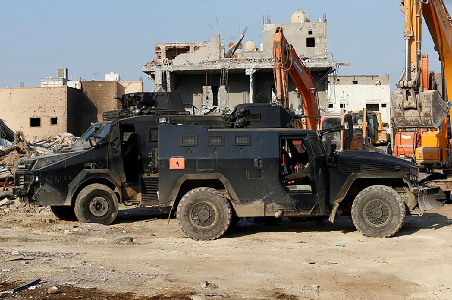 Vehicles belonging to Saudi forces are seen in the eastern town of Awamiya, following a security campaign against Shi'ite Muslim gunmen, August 9, 2017. 