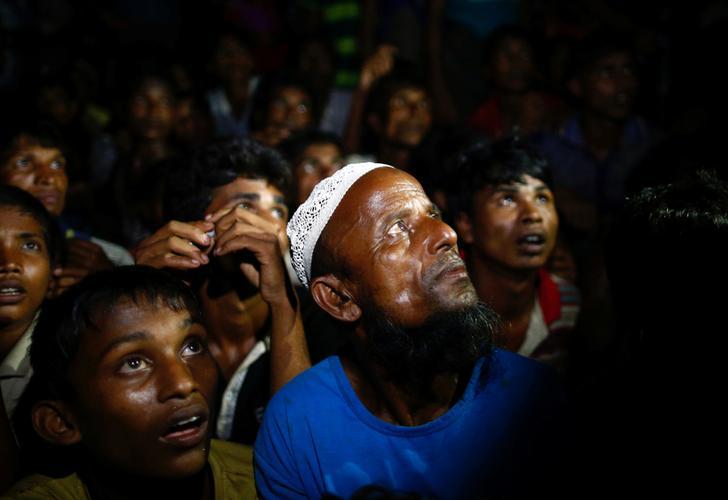 Rohingya refugees wait for food to be distributed by local organisations in Teknaf, Bangladesh on September 13, 2017. 