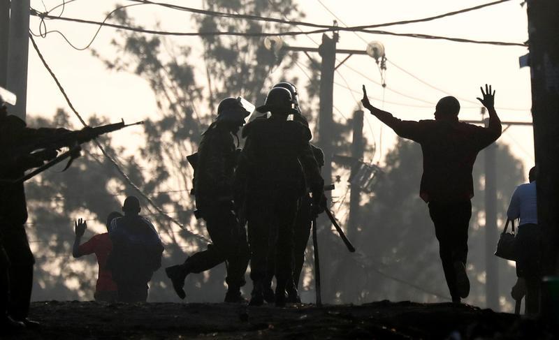 An opposition supporter gestures in front of policemen during clashes in Kawangware slum in Nairobi, Kenya October 30, 2017.