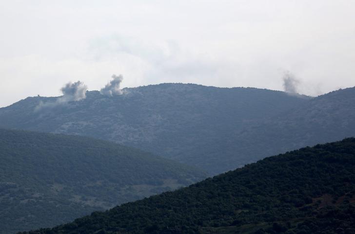 Smoke rises on the mountains as seen from Northern Afrin countryside, Syria on February 15, 2018.