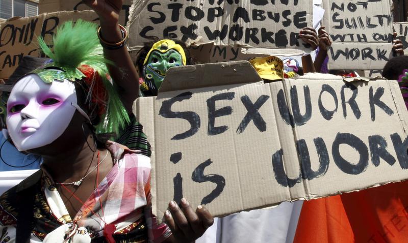 Sex workers wearing masks lead a march to mark International Sex Workers Rights Day in Johannesburg March 3, 2011