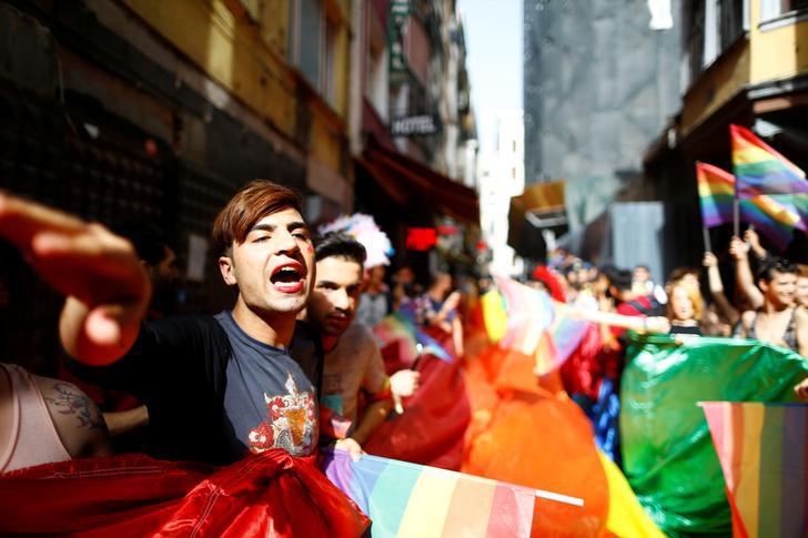 LGBT rights activists hold a rainbow flag during a transgender pride parade which was banned by the governor’s office, in central Istanbul, Turkey, June 19, 2016